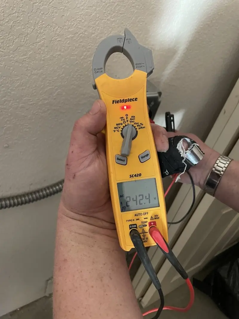 Voltage testing with clamp meter during Whole House Surge Protector in Henderson
